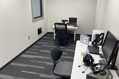 Narrow office space with computer and other equipment