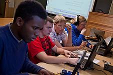 Landmark College professor and students in computer lab looking at screens